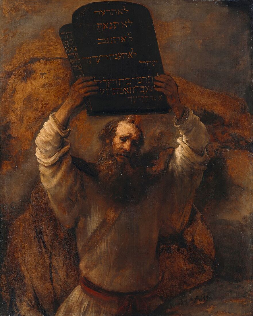 Rembrandt, "Moses with the Tablets of the Law" (1659). Moses lifts the tablets above his head — whether to display the covenant or to shatter it before a people that has fallen away.